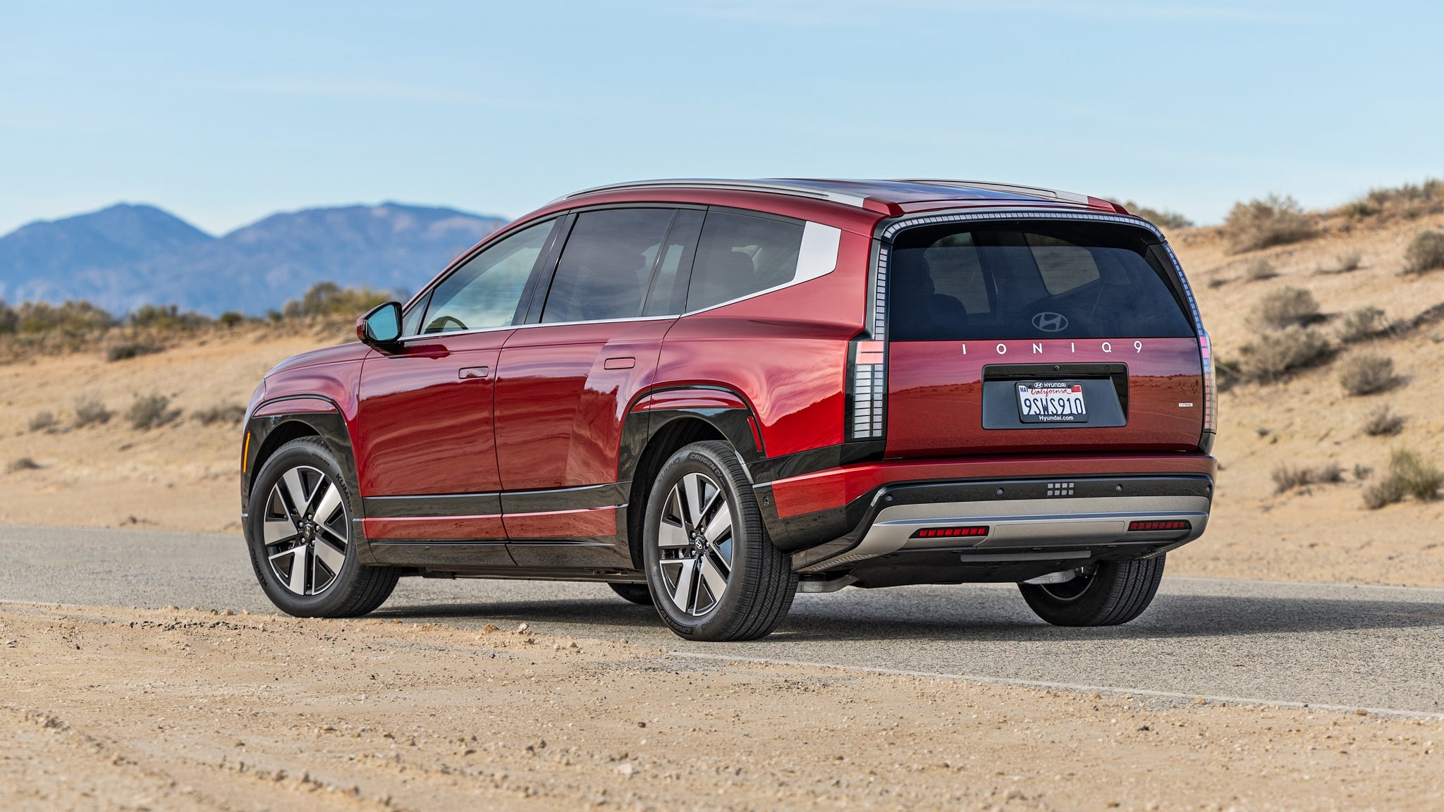 Electric SUV on a desert road.
